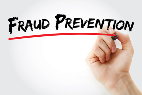 hand drawing a red line in marker underneath Fraud Prevention