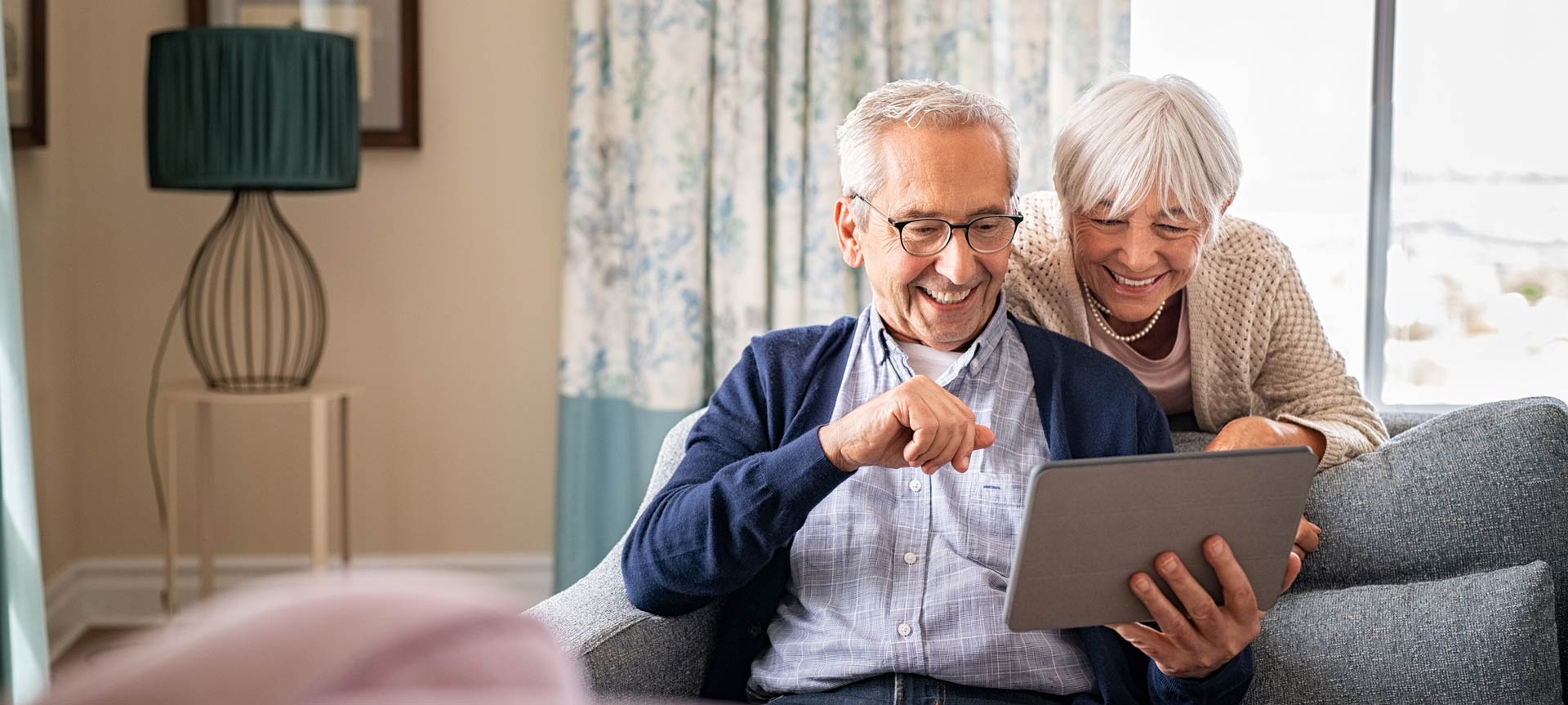 Senior couple using a digital tablet