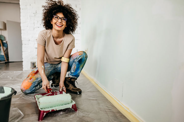 woman getting ready to paint a wall