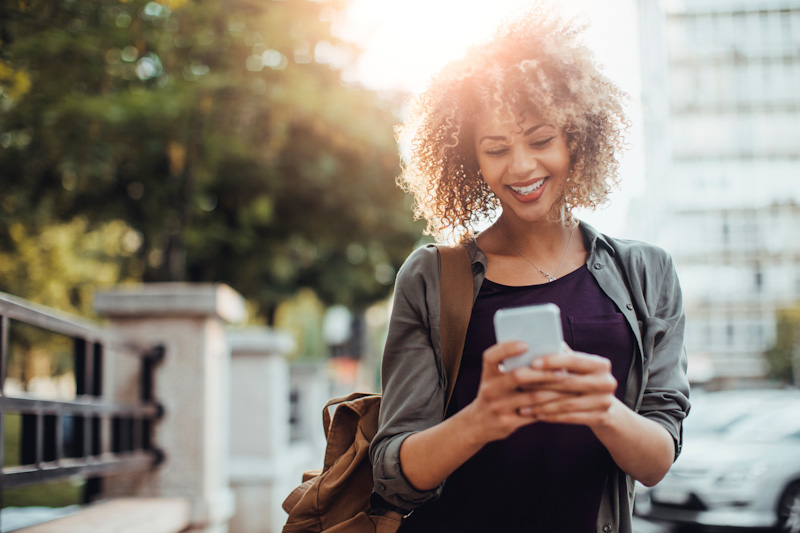 women outside on mobile phone