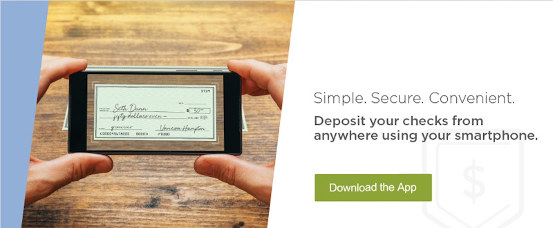 Hand holding a smartphone with the Bank of Bridger online application